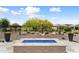 Desert landscaping with blue glass fire pit and desert landscaping at 21090 N 267Th Dr, Buckeye, AZ 85396
