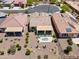 Aerial view of an outdoor patio with a seating area, artificial grass, and desert landscaping at 21090 N 267Th Dr, Buckeye, AZ 85396