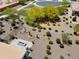 An aerial view shows a desert landscaped backyard with a built in fire-pit and seating area at 21090 N 267Th Dr, Buckeye, AZ 85396