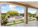 Inviting backyard with blue fire pit, artificial turf, and desert landscaping at 21090 N 267Th Dr, Buckeye, AZ 85396