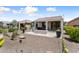 Desert landscaping with blue glass fire pit, patio, and desert landscaping at 21090 N 267Th Dr, Buckeye, AZ 85396