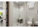 Modern bathroom with a glass-enclosed shower, a seat, and neutral decor at 21090 N 267Th Dr, Buckeye, AZ 85396
