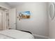 Bright bedroom features a mounted TV, neutral walls, and comfy bed at 21090 N 267Th Dr, Buckeye, AZ 85396