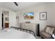 Bedroom features a walk-in closet, ensuite bathroom, and a mounted television at 21090 N 267Th Dr, Buckeye, AZ 85396