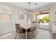 Light-filled dining area with sliding glass doors leading to outdoor patio at 21090 N 267Th Dr, Buckeye, AZ 85396