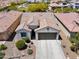 Aerial view of a charming single-story home with a well-manicured front yard at 21090 N 267Th Dr, Buckeye, AZ 85396