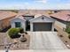 Aerial view of a charming single-story home with a well-manicured front yard at 21090 N 267Th Dr, Buckeye, AZ 85396