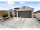 Inviting single-Gathering home with a spacious driveway, desert landscape, and a traditional architectural style at 21090 N 267Th Dr, Buckeye, AZ 85396