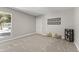 Neutral bedroom featuring carpet floors, ample natural light, and closet at 211 W Braeburn Dr, Phoenix, AZ 85023