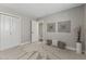 Bedroom featuring neutral carpet, closet space, and modern art at 211 W Braeburn Dr, Phoenix, AZ 85023