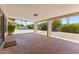 Large covered patio with stamped concrete and views of the sparkling pool at 211 W Braeburn Dr, Phoenix, AZ 85023