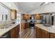 Bright kitchen featuring wood cabinets, granite countertops, and modern appliances for an efficient cooking experience at 211 W Braeburn Dr, Phoenix, AZ 85023