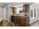 Kitchen with wood cabinets, granite countertops, stainless steel appliances and a breakfast bar perfect for entertaining at 211 W Braeburn Dr, Phoenix, AZ 85023