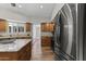 Contemporary kitchen with sleek, stainless steel appliances, granite countertops, and ample cabinet space at 211 W Braeburn Dr, Phoenix, AZ 85023