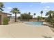 Inviting backyard swimming pool surrounded by palm trees and lush landscaping at 211 W Braeburn Dr, Phoenix, AZ 85023