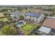 Aerial view showcases a backyard oasis with pool, putting green, hot tub, and solar panels at 21337 E Waverly Dr, Queen Creek, AZ 85142
