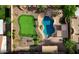 Aerial view featuring a backyard with a putting green, sparkling pool with a slide and hot tub at 21337 E Waverly Dr, Queen Creek, AZ 85142