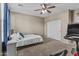 Bedroom with a bed, ceiling fan, closet, carpet, and space for gym equipment at 21337 E Waverly Dr, Queen Creek, AZ 85142