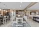 Bright dining area with seating for eight, view to other rooms, and open to the spacious kitchen at 21337 E Waverly Dr, Queen Creek, AZ 85142