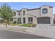 Beautiful two-story house with blue shutters, low maintenance front yard and a two-car garage at 21337 E Waverly Dr, Queen Creek, AZ 85142
