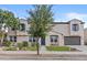Charming front exterior featuring a well-manicured lawn, mature tree, and desert landscaping at 21337 E Waverly Dr, Queen Creek, AZ 85142