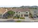 Beautifully landscaped two-story home with a tile roof, two car garage, and mature trees at 21337 E Waverly Dr, Queen Creek, AZ 85142