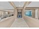 Well-lit hallway showcases access to the kitchen, living spaces, and a bright blue room at 21337 E Waverly Dr, Queen Creek, AZ 85142