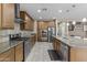 Well-equipped kitchen featuring modern appliances, granite countertops, and ample storage space at 21337 E Waverly Dr, Queen Creek, AZ 85142