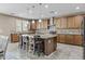 Spacious kitchen with a large island, granite countertops, stainless steel appliances, and ample cabinetry at 21337 E Waverly Dr, Queen Creek, AZ 85142
