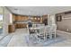 Open kitchen featuring a large island, modern appliances, and an adjacent dining area at 21337 E Waverly Dr, Queen Creek, AZ 85142