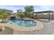 Resort-style pool with a slide, hot tub, pergola, and a well-manicured patio area at 21337 E Waverly Dr, Queen Creek, AZ 85142