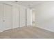 Bedroom featuring neutral carpet, closet and an open door to another room at 22502 W Tonopah Dr, Surprise, AZ 85387