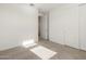 Carpeted bedroom with sliding closet doors at 22502 W Tonopah Dr, Surprise, AZ 85387