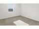 Cozy bedroom with a window, carpet, and neutral walls at 22502 W Tonopah Dr, Surprise, AZ 85387