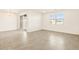 Bright and spacious living area featuring tile flooring and natural light from window at 22502 W Tonopah Dr, Surprise, AZ 85387