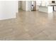 Bright living space showcasing tile flooring, kitchen access, and ample room at 22502 W Tonopah Dr, Surprise, AZ 85387