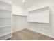 Walk-in closet with shelving and racks at 22502 W Tonopah Dr, Surprise, AZ 85387