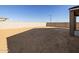 Large backyard with a cinder block wall, perfect for landscaping and entertaining outdoors at 22514 W Tonopah Dr, Surprise, AZ 85387