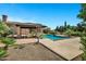Beautiful backyard with lush greenery and gorgeous pool at 2300 E Sanoque Ct, Gilbert, AZ 85298