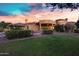 Expansive backyard with lush lawn, manicured hedges, and a glimpse of the elegant home design at 2300 E Sanoque Ct, Gilbert, AZ 85298