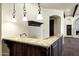 Bar area with granite countertop and detailed woodwork at 2300 E Sanoque Ct, Gilbert, AZ 85298
