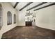 Open bar with dark wood and granite top at 2300 E Sanoque Ct, Gilbert, AZ 85298