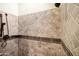 Shower with beige accent tiles and shower head in the wall at 2300 E Sanoque Ct, Gilbert, AZ 85298