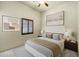 Beautiful bedroom featuring a ceiling fan, neutral tones, and unique art at 2300 E Sanoque Ct, Gilbert, AZ 85298