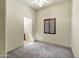 Bedroom with a ceiling fan, neutral carpet and a dark shuttered window at 2300 E Sanoque Ct, Gilbert, AZ 85298