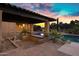 Outdoor living space with a covered patio, outdoor kitchen, tile flooring, and a view of the pool at 2300 E Sanoque Ct, Gilbert, AZ 85298