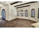 Dining area showing wood beam ceiling and access to entry foyer at 2300 E Sanoque Ct, Gilbert, AZ 85298