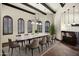 Elegant dining room with beamed ceiling, marble table and bar at 2300 E Sanoque Ct, Gilbert, AZ 85298