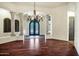 Open dining room with hardwood floors and decorative chandelier at 2300 E Sanoque Ct, Gilbert, AZ 85298