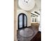 Elegant foyer features decorative iron doors, tile flooring, and architectural columns for a grand entrance at 2300 E Sanoque Ct, Gilbert, AZ 85298